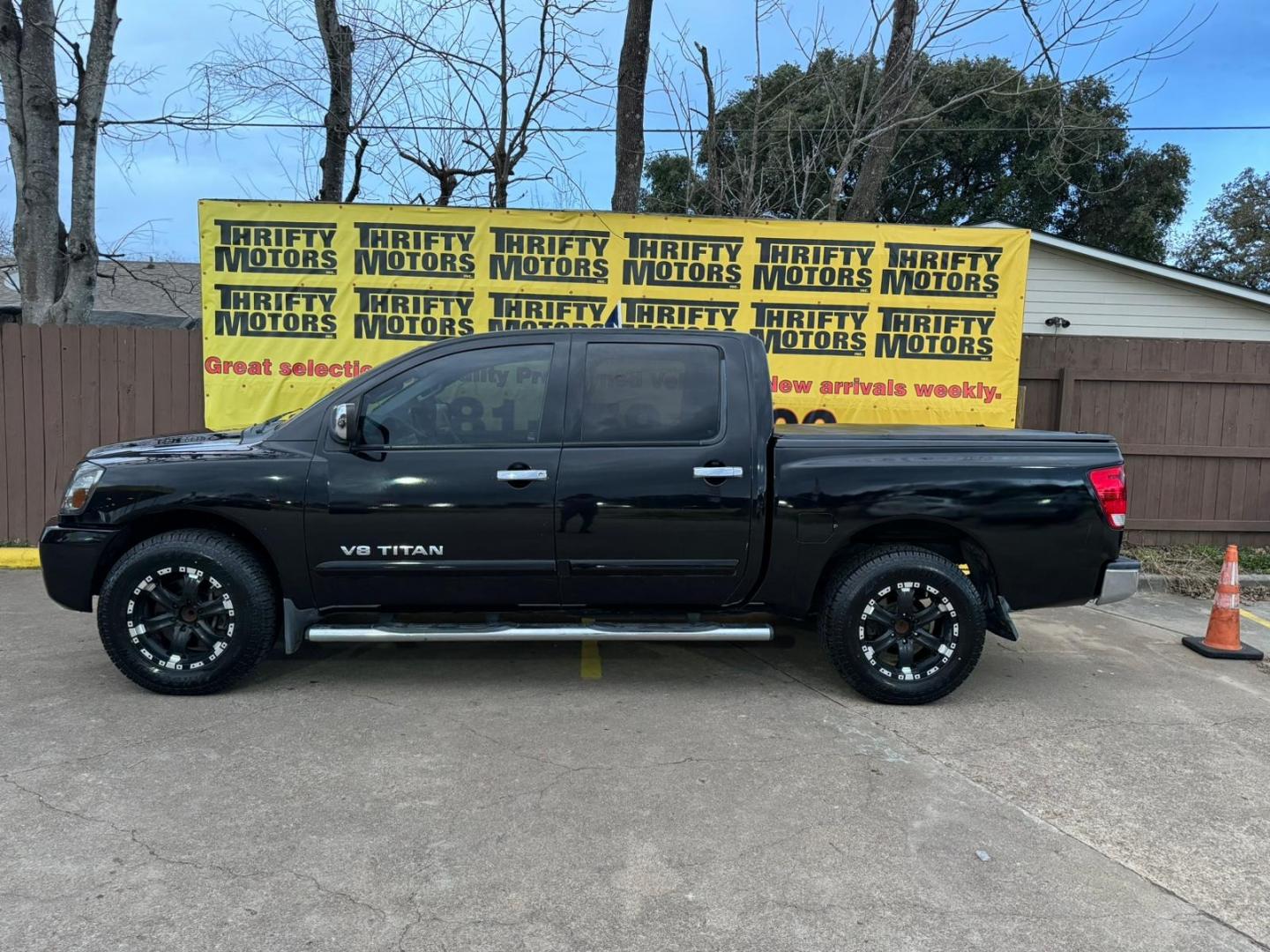 2012 Nissan Titan (1N6BA0ED2CN) , located at 16710 Clay Rd., Houston, TX, 77084, (281) 859-7900, 29.834864, -95.656166 - Photo#3